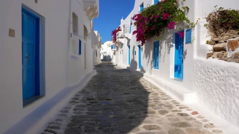 Charming Whitewashed Street with Blue Doors on a Greek Island