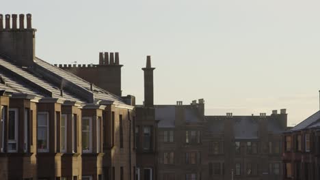 golden hour over classic tenement chimneys on a crisp winter morning
