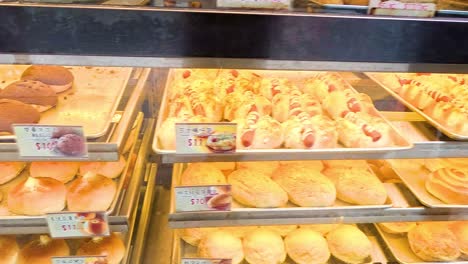 assorted pastries and breads in a bakery