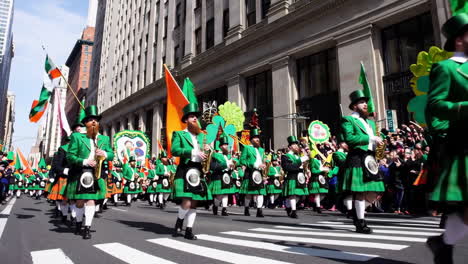 st. patrick's day parade featuring a marching band in traditional irish attire and kilts