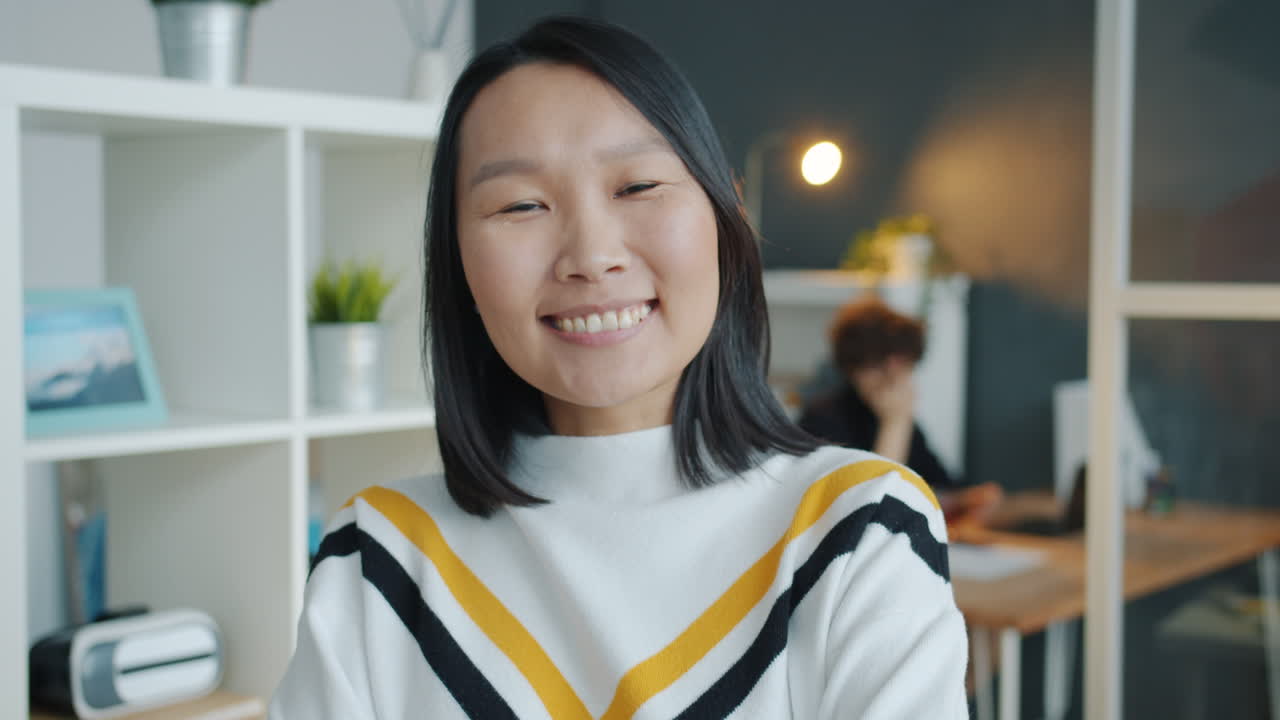 Smiling Asian woman in an office