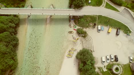 aerial view of a small bridge at soca river, slovenia.