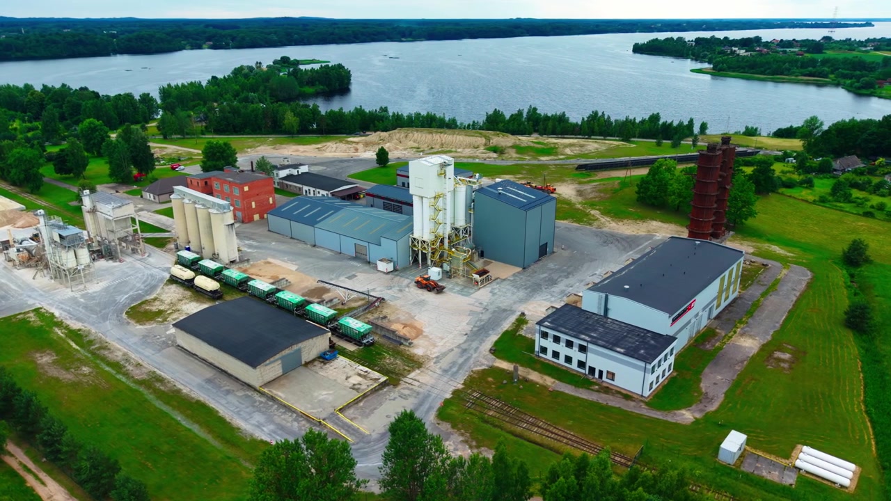 Mineral processing plant silos historic lime kilns and Daugava riverside