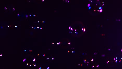 different soap bubbles on violet background close up a lot of different soap bubbles isolated on violet background close up