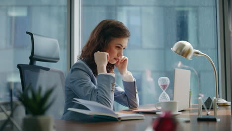 girl employee texting laptop sitting office table close up. lady boss working