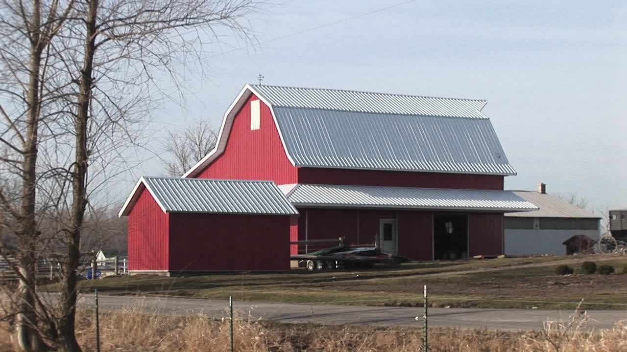 This Bright Red Barn Stands Out On This Rather Cloudy Winter Day
