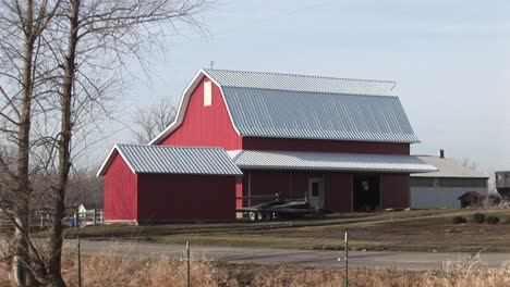 this bright red barn stands out on this rather cloudy winter day