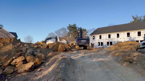 New-house-foundation-in-development-with-bulldozer-and-equipment