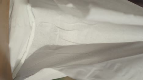close-up view of tissue paper being folded