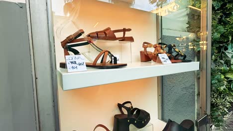 various shoes showcased in a naples store window