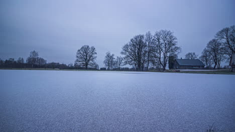 time-lapse of a european countryside landscape transforming through winter snow, spring blooms, summer greenery, and autumn colors