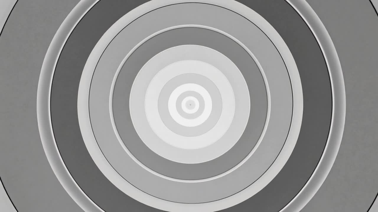 Animating concentric bands on gray frame, shifting light-dark rings, sharpening edges, dimming core