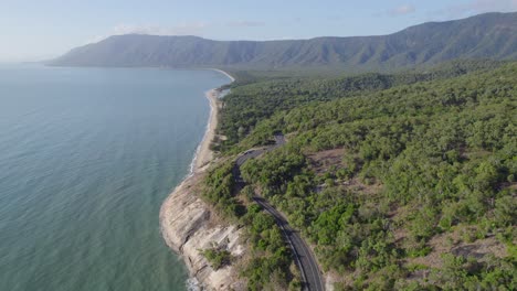 Rex-Lookout---Cars-Driving-Through-Asphalt-Coastal-Road-Along-The-Coral-Sea-Near-The-Wangetti-In-Australia