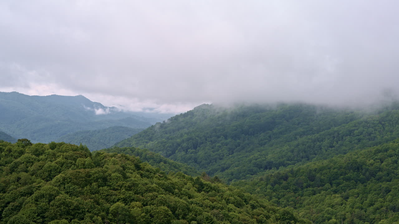 Sweeping drone footage of misty, fog-filled Smoky Mountains