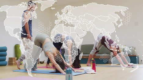 animation of world map and processing data over diverse male instructor and female yoga class