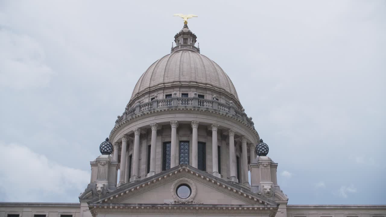 Close up, dome: Stormy skies over the Mississippi State Capitol building. Jackson, MS