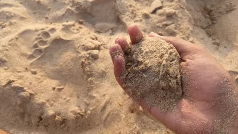 playing with the beach sand