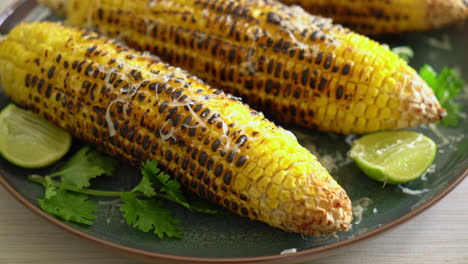 barbecue-and-grilled-corn-with-cheese-and-lime-on-plate