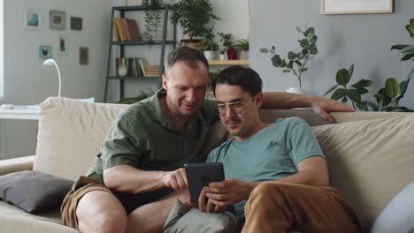 gay couple relaxing at home