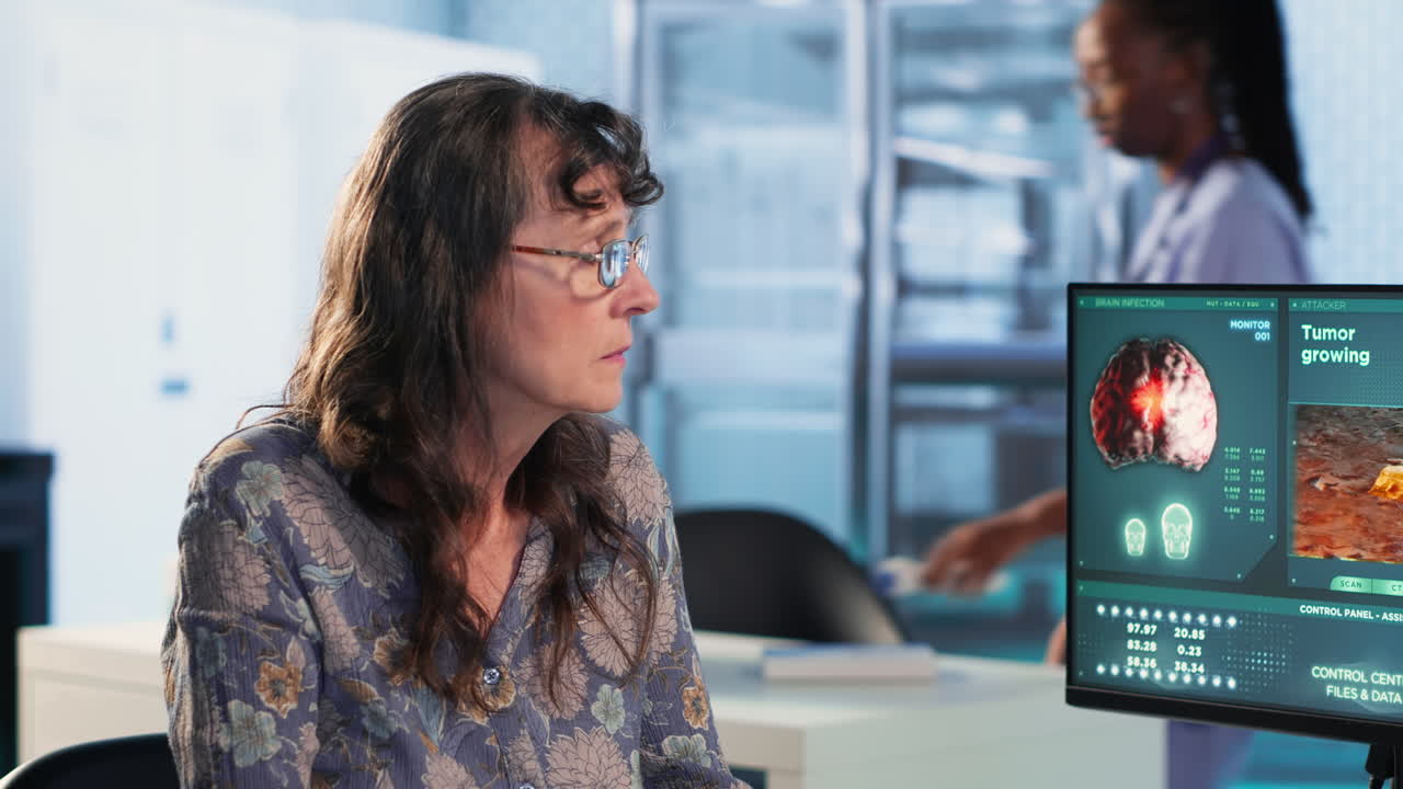Vertical Video Male oncology specialist reviewing a radiology scan with elderly woman patient
