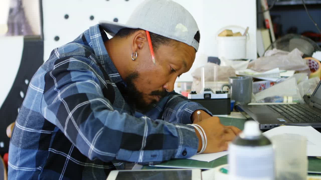 Man drawing design on paper 4k