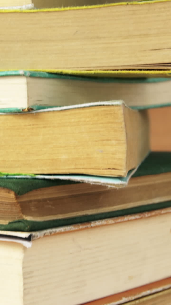 Stack of various books on a desk