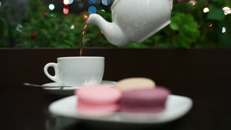 tea with macaroons in cafe