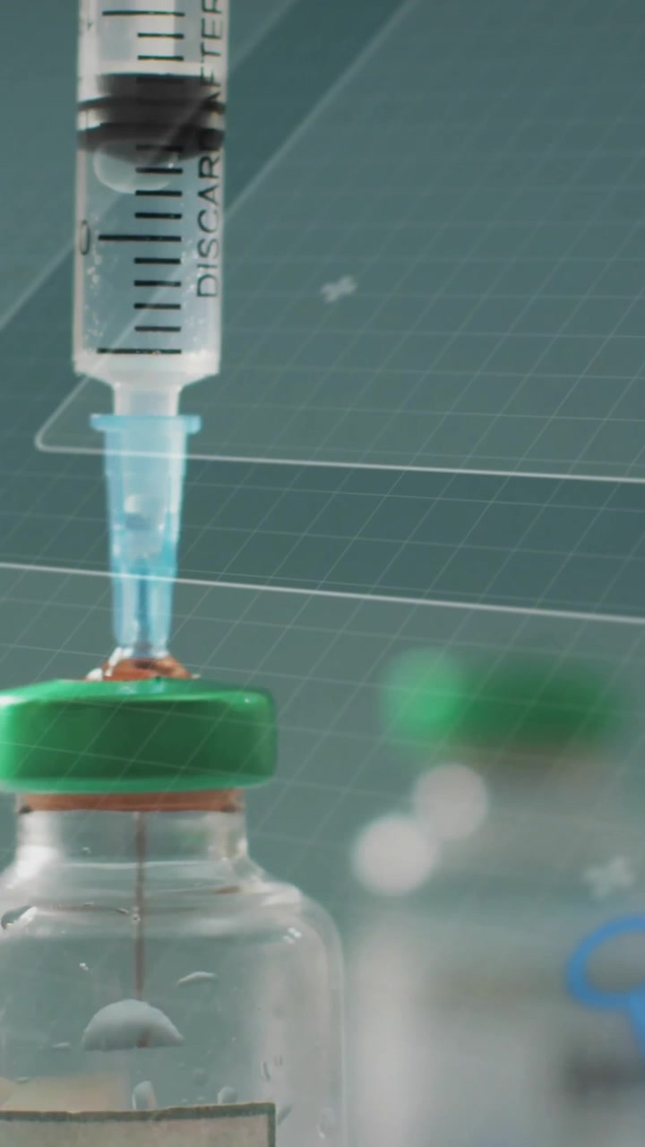 Syringe drawing liquid from vial over scientific data and world map animation