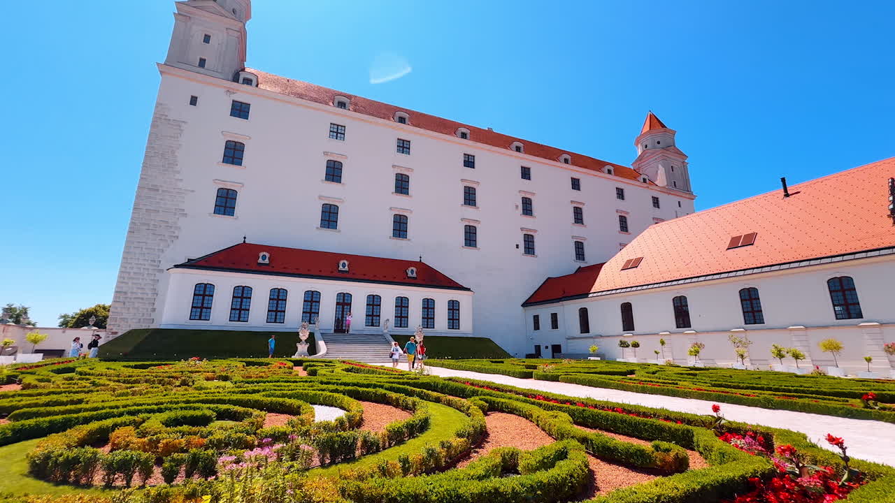 Lovely large flower-bed in front of the Bratislava Castle. Low angle view at the stunning landmark of Slovakia