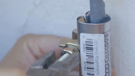 man-using-an-incorrect-tool-to-tighten-a-bolt