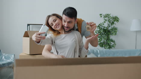 couple celebrates moving into new home with selfie