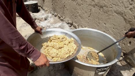 rice from pot to tray using a skimmer