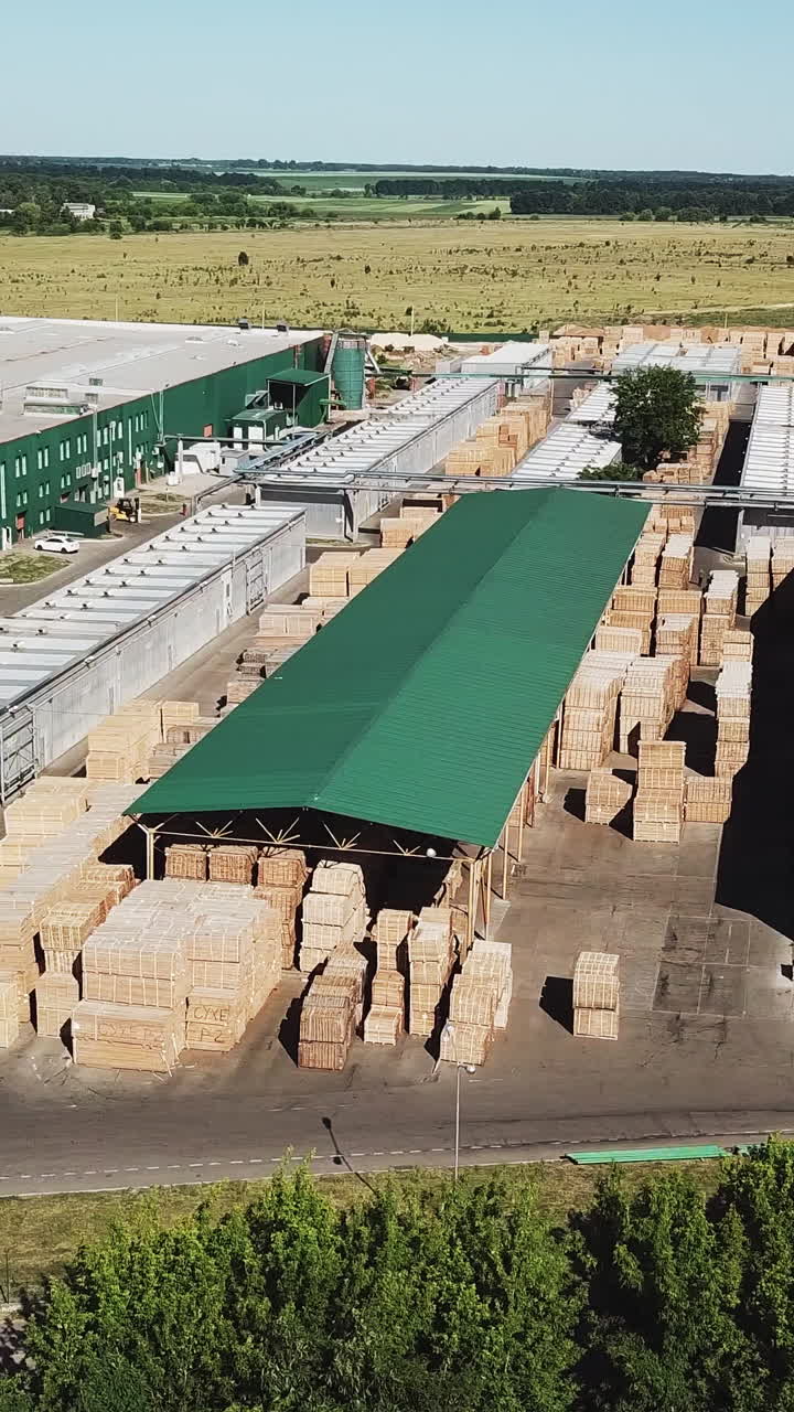 Aerial view of a large wood processing factory. Industrial complex Vertical video