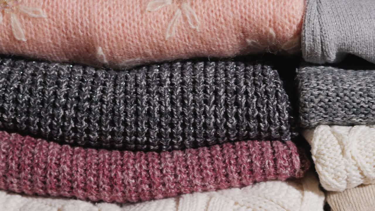 Slider video: Neatly folded winter clothes