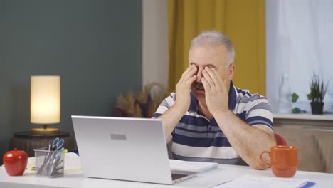 Home-office-worker-old-man-has-eye-pain.