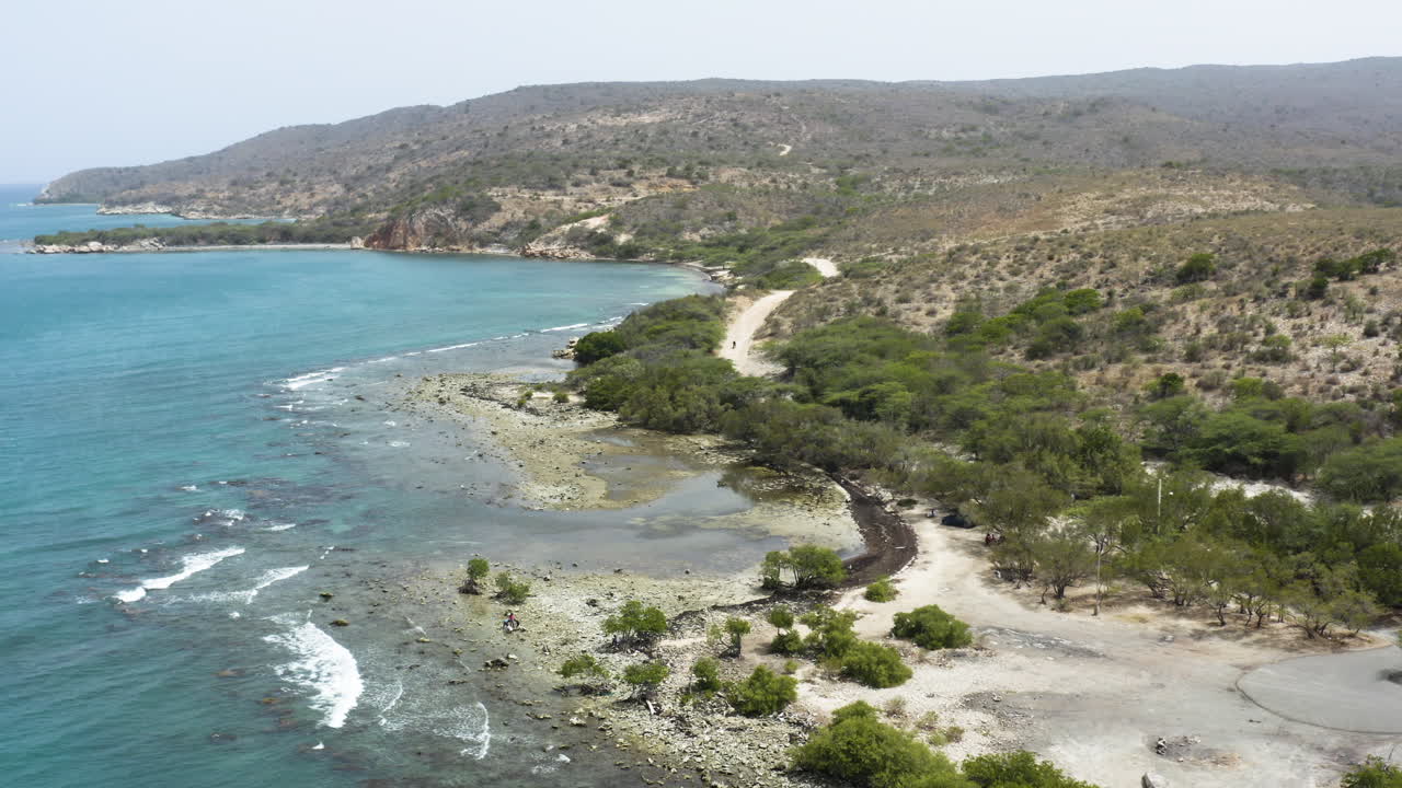 AERIAL - Beautiful Monte Rio beach, Azua, Dominican Republic, lowering shot