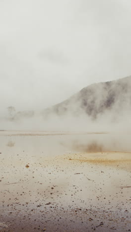 misty geothermal landscape