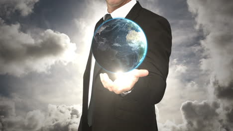 Businessman-holding-digital-generated-globe