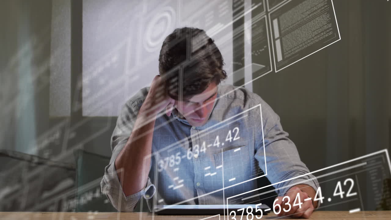 Man analyzing tablet in technology office, showing floating charts and numeric data overlays