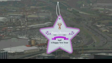 Star-shaped-happy-christmas-and-new-year-text-banner-against-aerial-view-of-cityscape