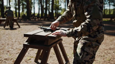 soldier maintaining a rifle at a shooting range