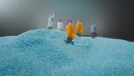 office workers with briefcases on way to work on blue sand