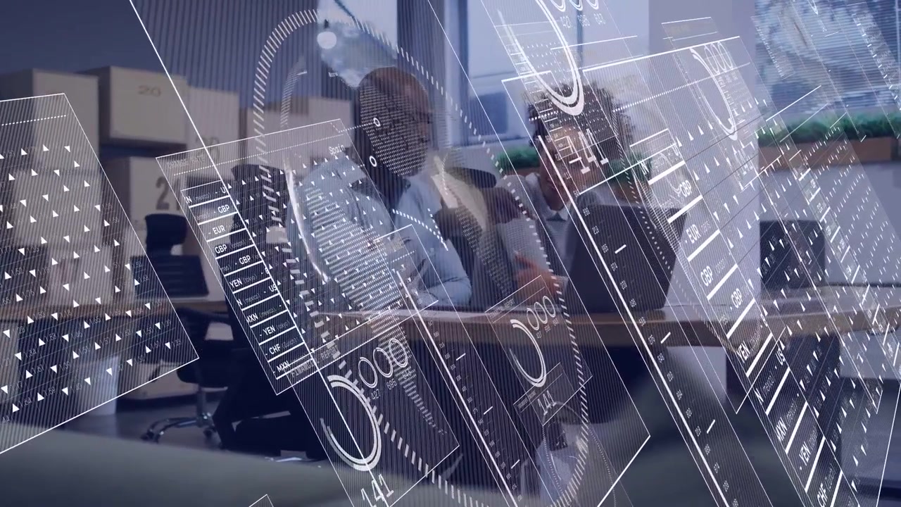 Man pointing at laptop, woman leaning and typing, HUD overlaying charts for business review