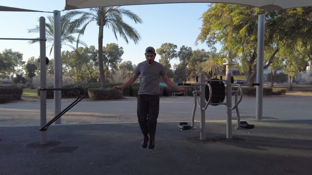 Young man skipping rope