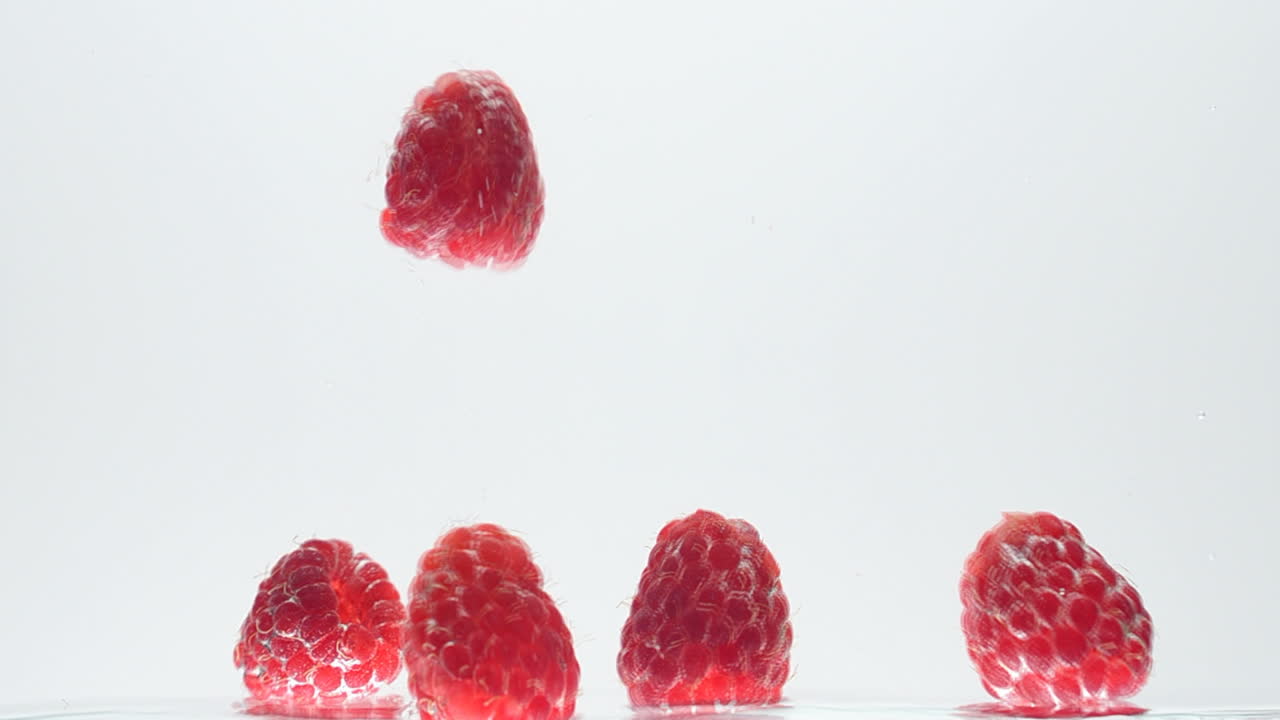 Raspberry on a white background. Shooting on a white background