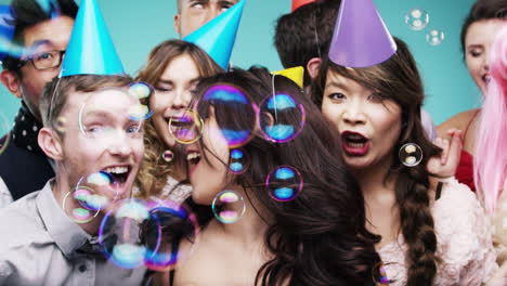 Multi-racial-group-of-happy-people-dancing-with-bubbles-slow-motion-party-photo-booth