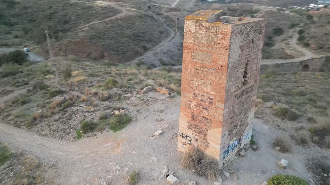 Experience the historic Tower of Jaral in Almayate Bajo from a mesmerizing drone's-eye view