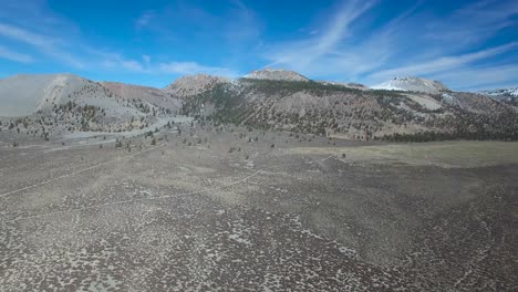 High-aerial-shot-over-desert-reveals-the-Mono-volcano-cones-in-the-Eastern-Sierra-Nevada-mountains