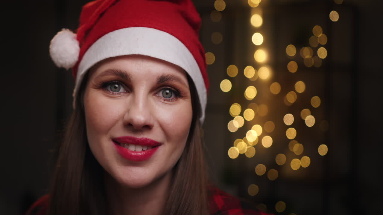 Woman in santa hat smiling