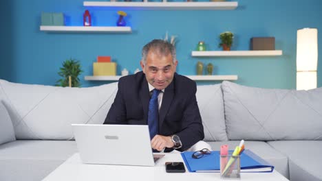 home office worker man making cute gesture at camera.